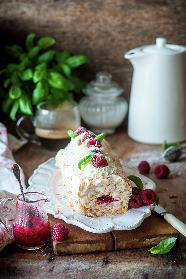Coconut Meringue Roll With Raspberries Photograph by Irina Meliukh