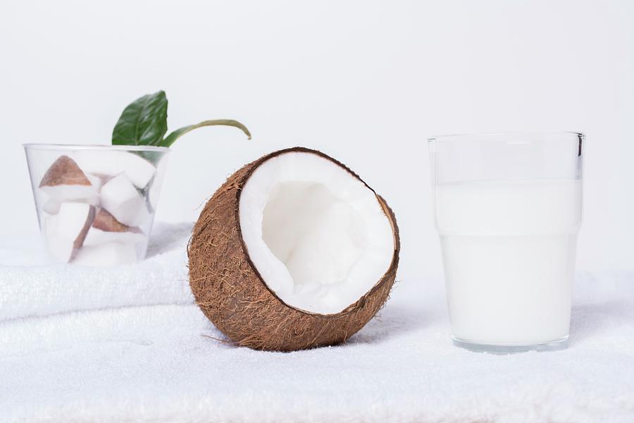 Coconut Milk And An Open Coconut Photograph by Marya Cerrone