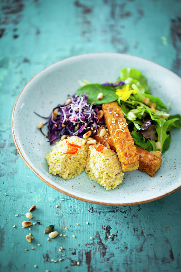 Coconut Millet With Tempeh, Red Coleslaw And Salad With A Pear Dressing Photograph by Jan Wischnewski