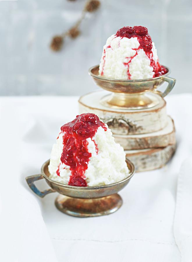 Coconut Rice Pudding Cakes With Raspberry Sauce For Christmas Photograph by Jalag / Maryam Schindler