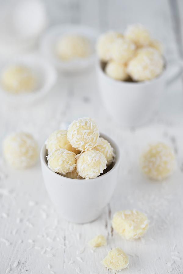 Coconut Truffles In A White Cup Photograph by Malgorzata Laniak