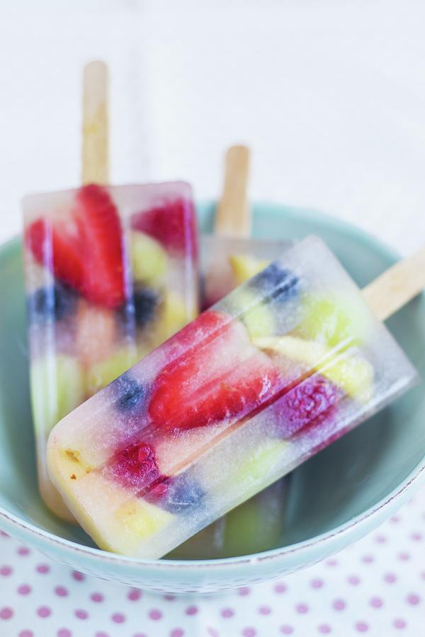 Coconut Water And Fresh Fruit Ice Lollies Photograph by Tina Engel