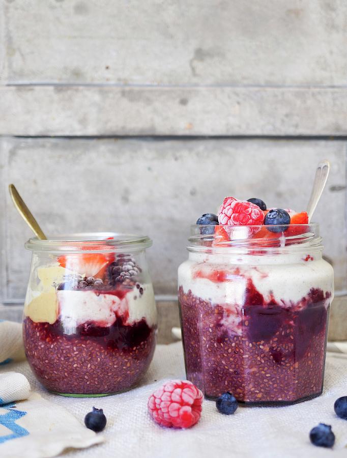 Coconut Yoghurt, Chia Seeds And Frosty Summer Berry Pudding Jars Photograph by Velsberg