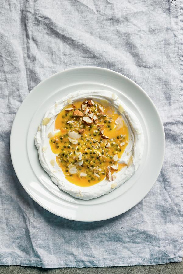 Coconut Yoghurt With Passionfruit Sauce Photograph by Sarka Babicka