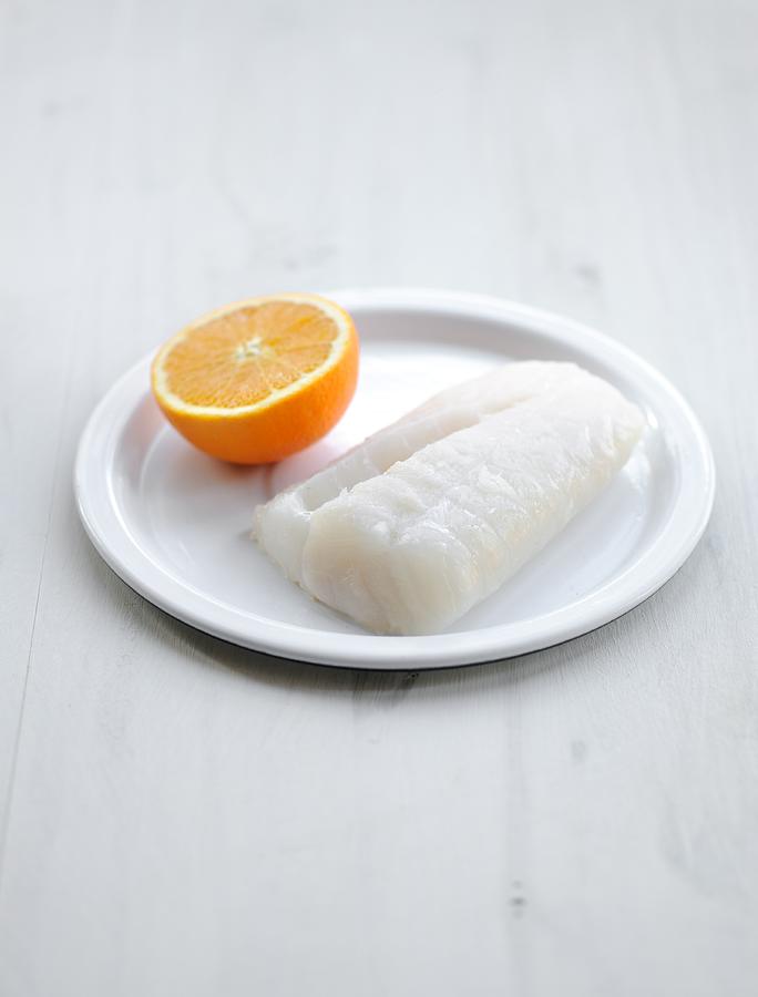 Cod Fillet And Half An Orange Photograph by Carnet