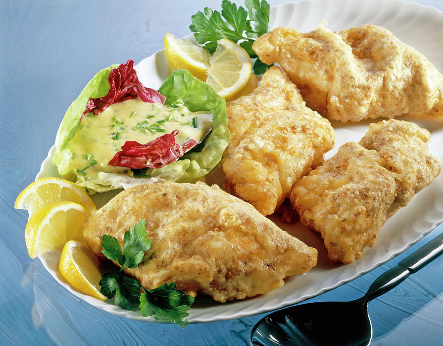 Cod Fillet With Crispy Sesame Crust, Mayonnaise, Salad And Lemon On ...