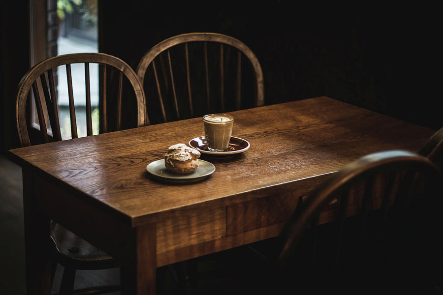 Coffee And Pastry On Wooden Table In Cafe Photograph by Mel Boehme