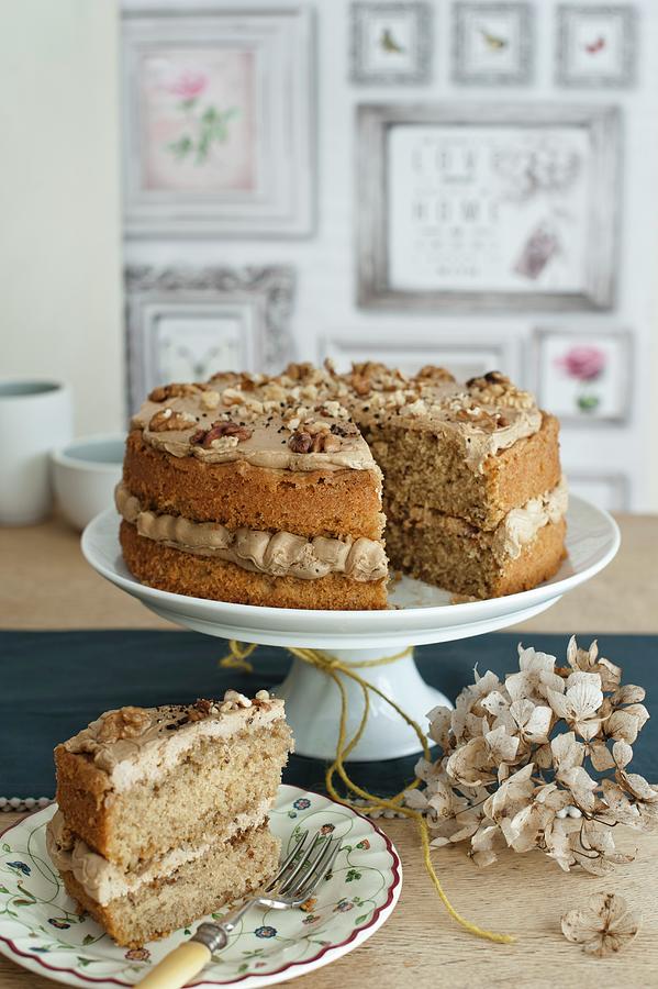 Coffee And Walnut Cake On A Cake Stand; Sliced Photograph by Magdalena Hendey