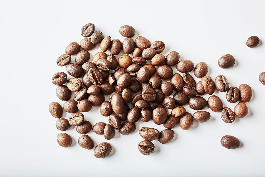 Coffee Beans On A White Background Photograph by Herbert Lehmann
