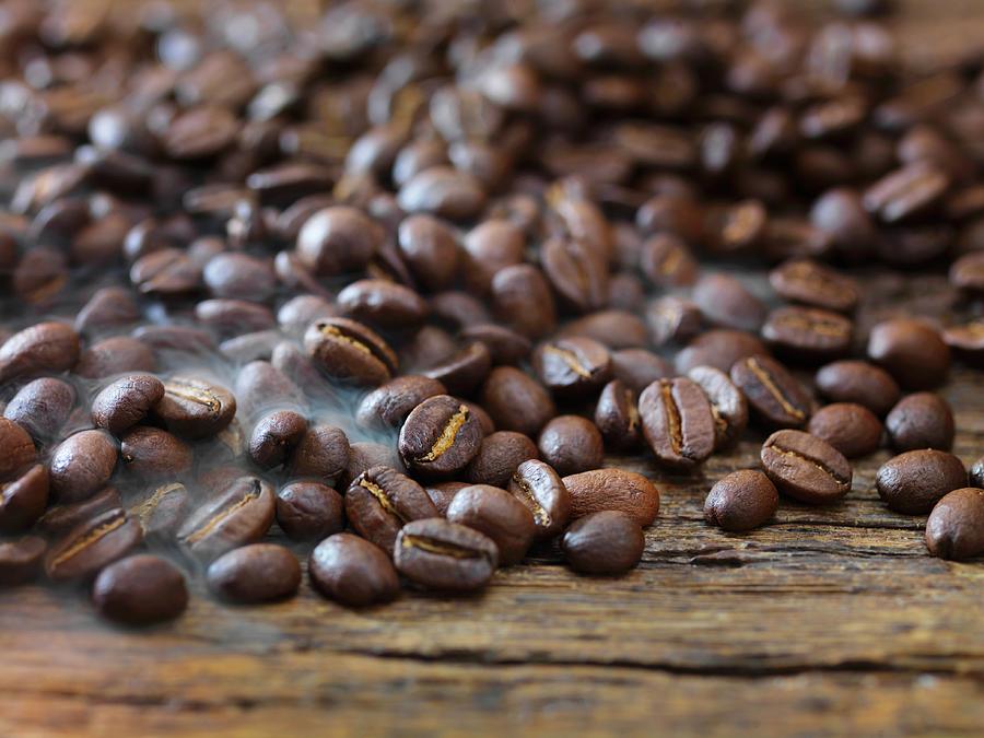 Coffee Beans On Wooden Background Photograph by Johnny Taylor Photography