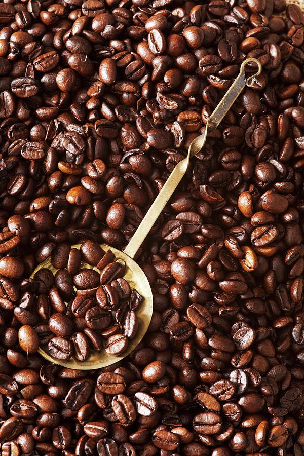 Coffee Beans With An Ornate Brass Spoon Photograph by Stacy Grant
