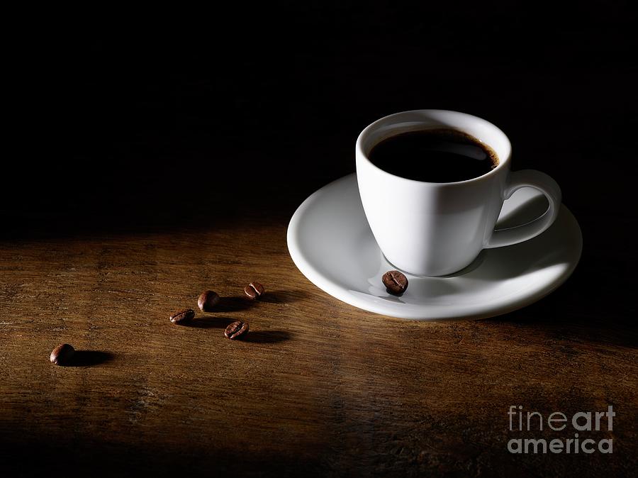 Coffee In Coffee Cup With Beans On Wooden Table Photograph by Science Photo Library