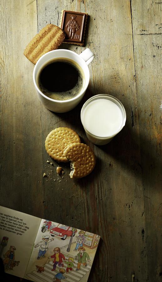 Coffee, Milk, Biscuits And A Childrens Book Photograph by Mikkel Adsbl