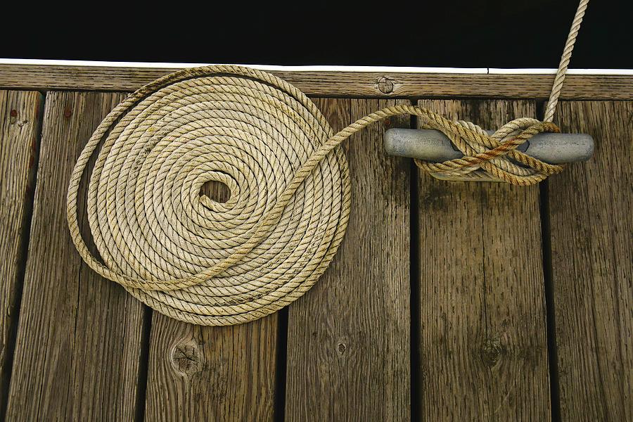 Coiled Rope on a Pier Photograph by Rob Johnston
