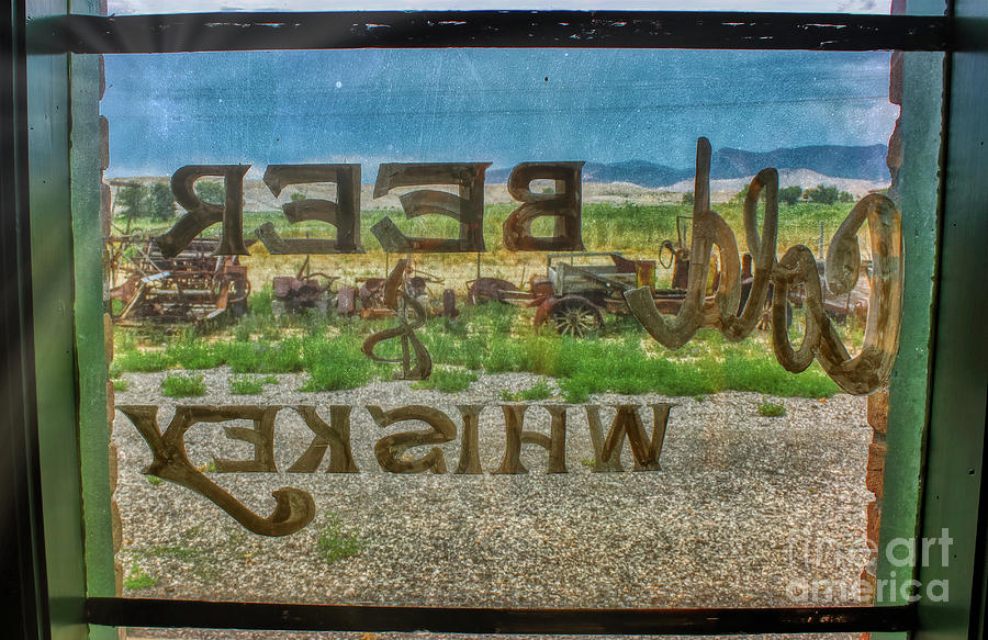 Cold Beer and Whiskey Sign Through Glass Pane Photograph by Janice Pariza