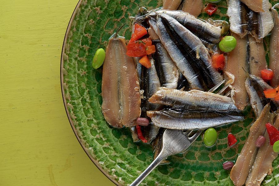 Cold Smoked Anchovy Fillets With Edamame And Red Pepper On Rustic Green Textured Plate On Vintage Yellow Table Photograph by Artfeeder