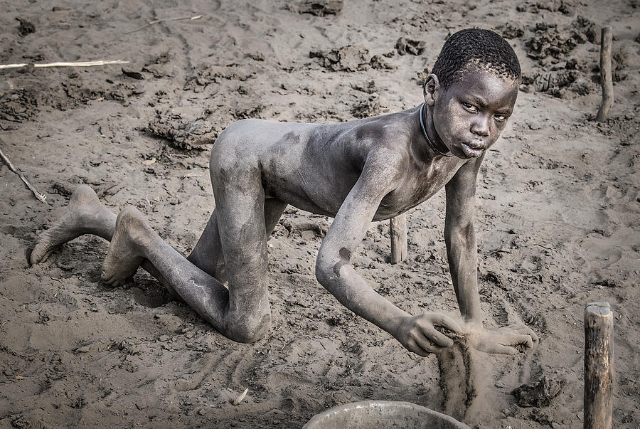Collecting Dung In A Mundari Cattle Camp-i - South Sudan Photograph by Joxe Inazio Kuesta Garmendia