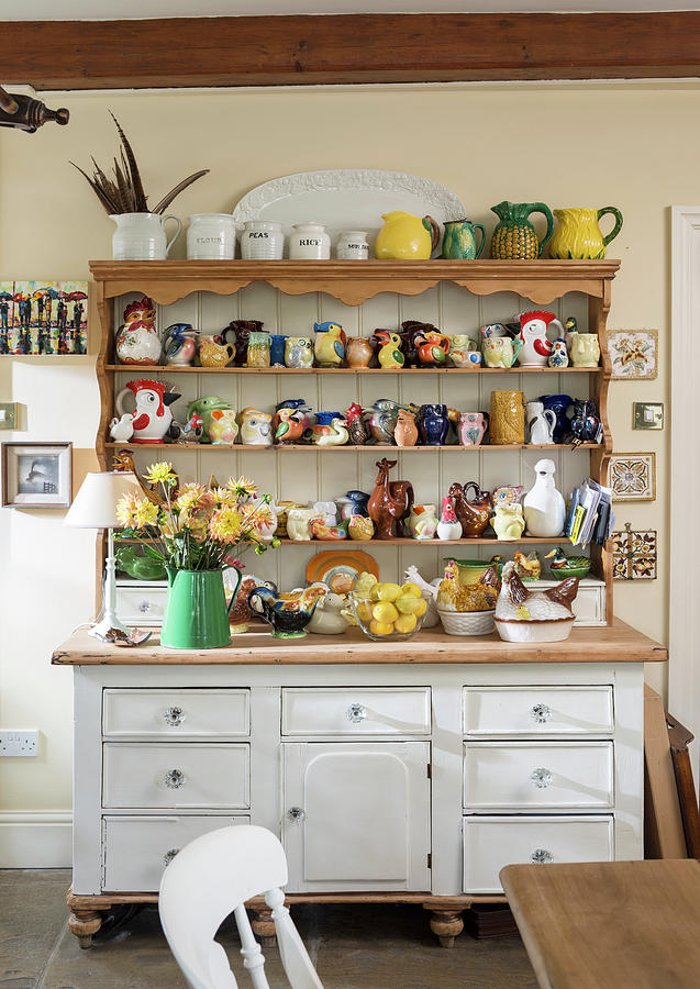 Collection Of Ceramic Animals On Rustic Dresser Photograph by Brian Harrison
