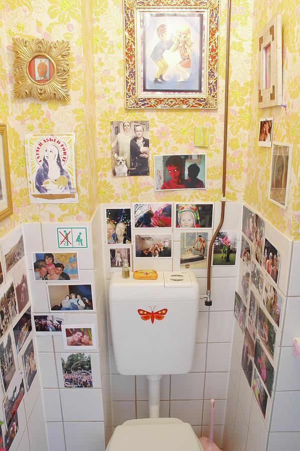Collection Of Photos & Pictures On Tiled And Papered Walls In Toilet Photograph by James Stokes