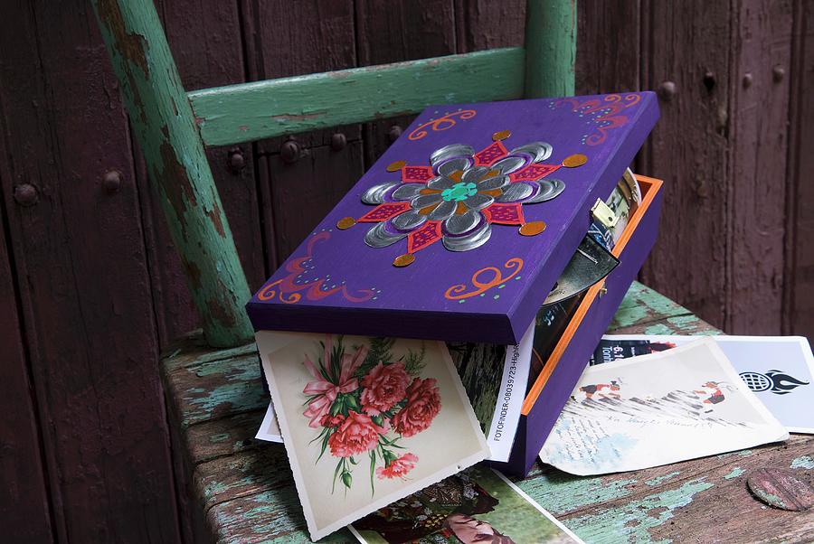 Collection Of Post Cards In Painted And Decorated Wooden Box On Vintage Chair Photograph by Matteo Manduzio