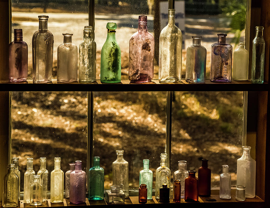 Colored Bottles Photograph by Ray Silva