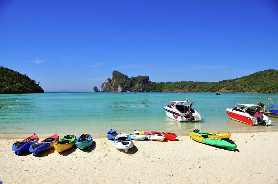 Colorful Canoes On Beach Photograph by Aaron Geddes Photography
