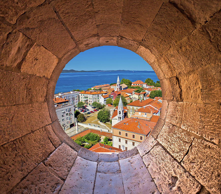 Colorful city of Zadar rooftops and towers view through stone wi Photograph by Brch Photography