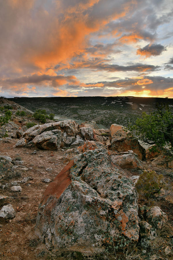 Colorful Clouds and Boulders at the Bentonite Site Photograph by Ray Mathis