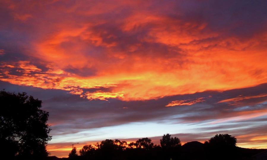 Colorful Clouds Photograph by Caroline Haldeman - Fine Art America