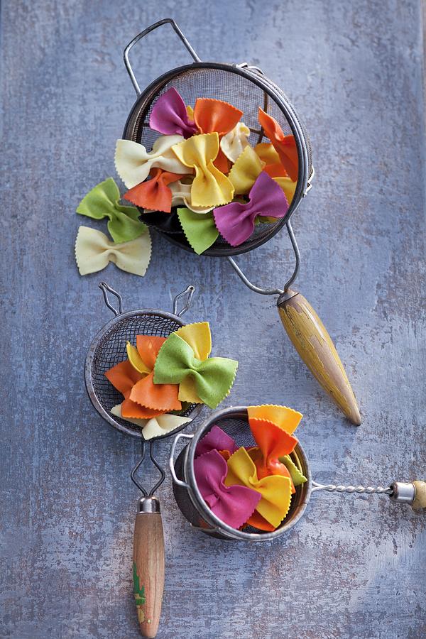 Colorful Farfalle Pasta In A Colander Photograph by Eising Studio
