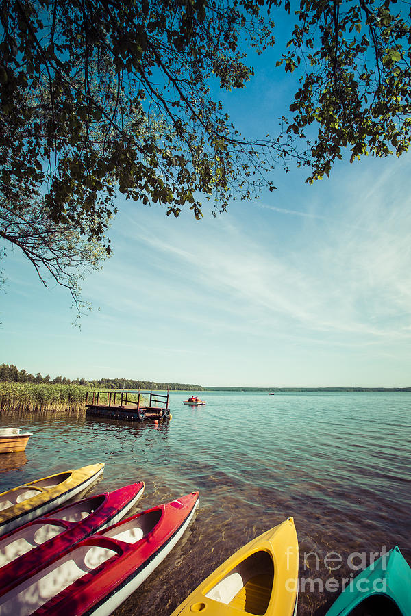 Sailboat Photograph - Colorful Kayaks Moored On Lakeshore by Curioso Sailboat Photograph - Colorful Kayaks Moored On Lakeshore by Curioso