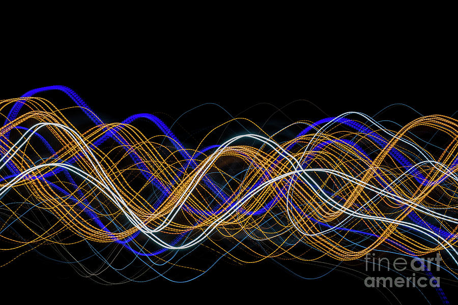 Colorful light painting with circular shapes and abstract black background. Photograph by Joaquin Corbalan