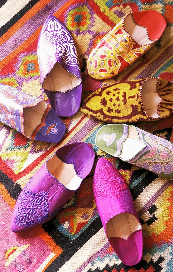 Colorful Moroccan Slippers Arranged In A Star-shape Photograph by Guy Bouchet