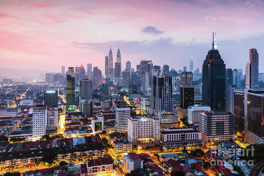 Colorful sunrise over Kuala Lumpur skyline, Malaysia Photograph by Matteo Colombo