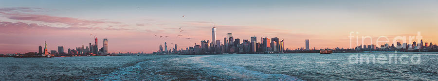 Colorful Sunrise Over the New York Skyline and The Statue of Lib by PorqueNo Studios Colorful Sunrise Over the New York Skyline and The Statue of Lib by PorqueNo Studios