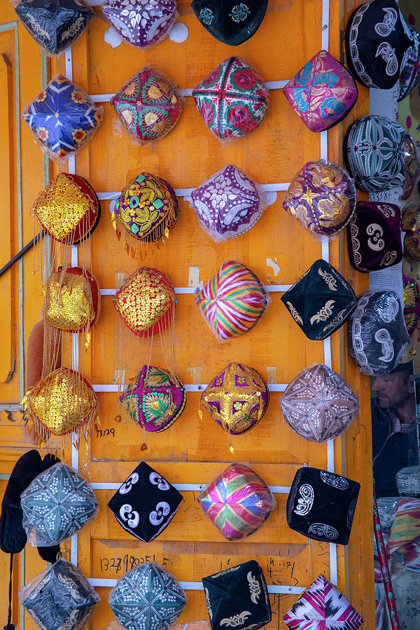 Colorful Uigher hats on display Photograph by Karen Foley