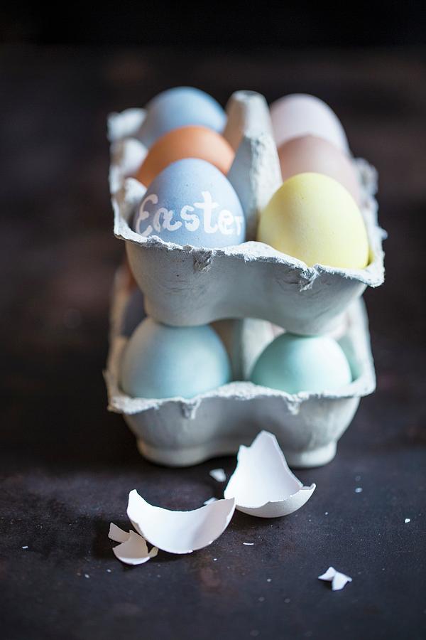 Colorfully Dyed Easter Eggs In Egg Carton Photograph by Eising Studio