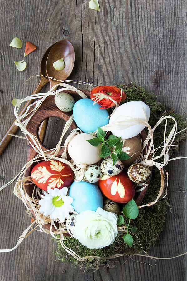 Coloured Easter Eggs In A Wooden Bowl And Wooden Cutlery Photograph by Lana Konat