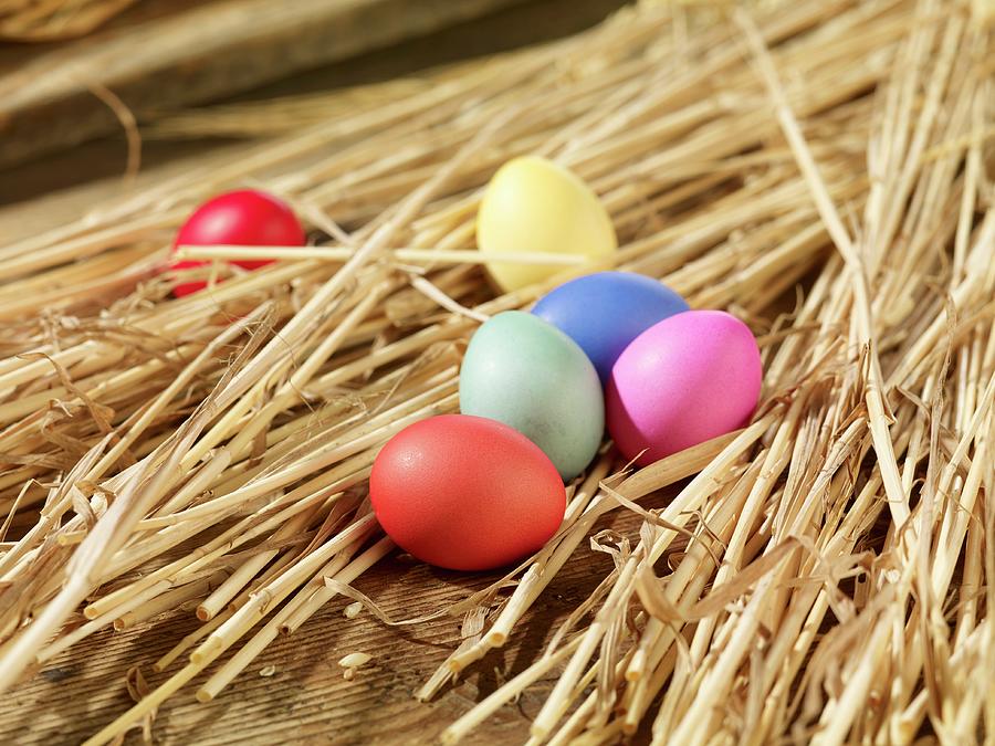 Coloured Easter Eggs In Straw Photograph by Studio R. Schmitz