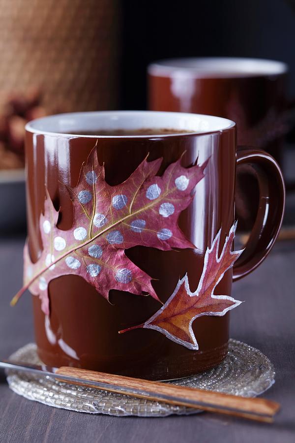Colourful Autumn Leaves Stuck On Brown Coffee Mug Photograph by Franziska Taube