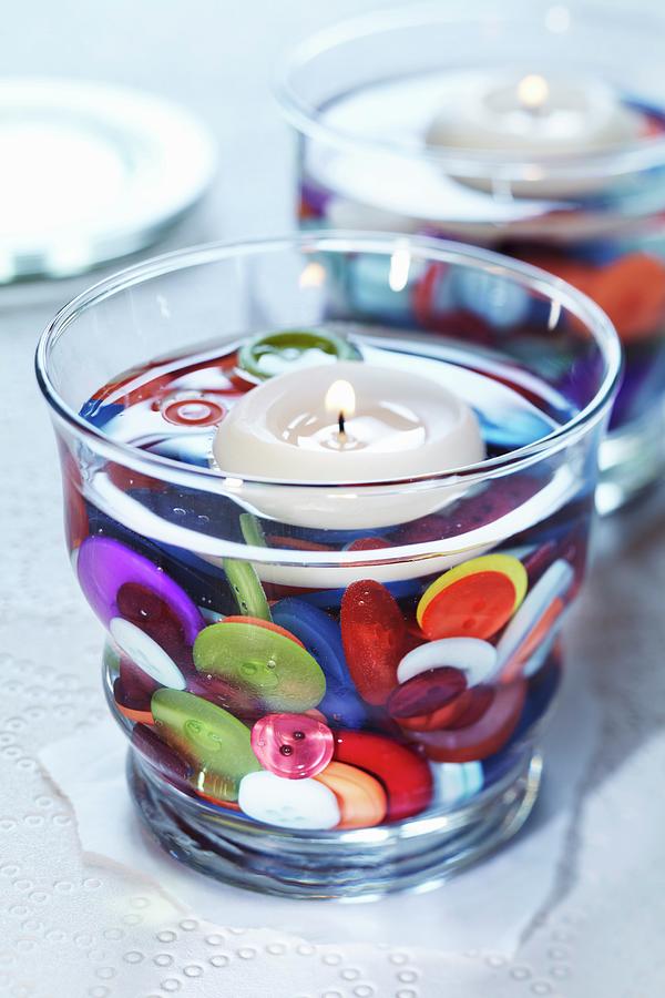 Colourful Buttons As Decoration In Water-filled Candle Lantern With Floating Candle Photograph by Franziska Taube