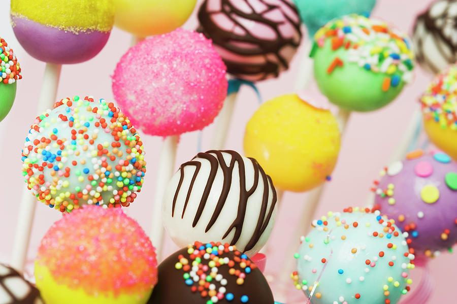 Colourful Cake Pops With Assorted Decorations Photograph by Burgess