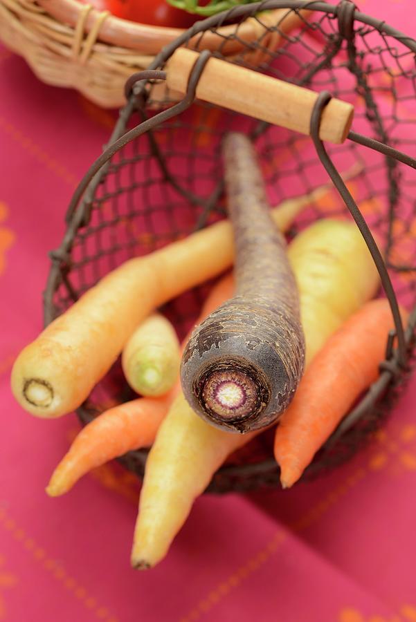 Colourful Carrots In A Wire Basket Photograph by Alain Caste