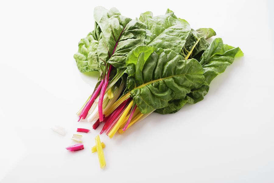 Colourful Chard On A White Surface Photograph by Great Stock!