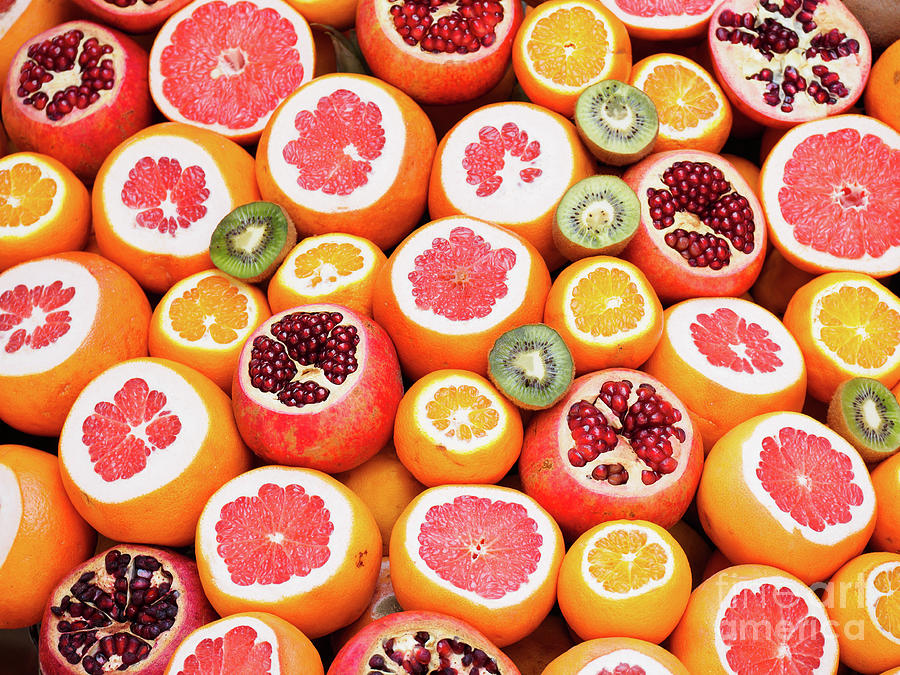 Colourful Circles Of Fresh Juicy Fruit Photograph by Whitworth Images