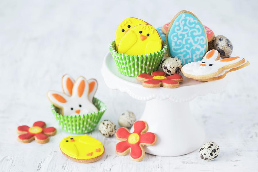 Colourful Easter Biscuits And Quails Eggs On A Cake Stand Photograph by Malgorzata Laniak