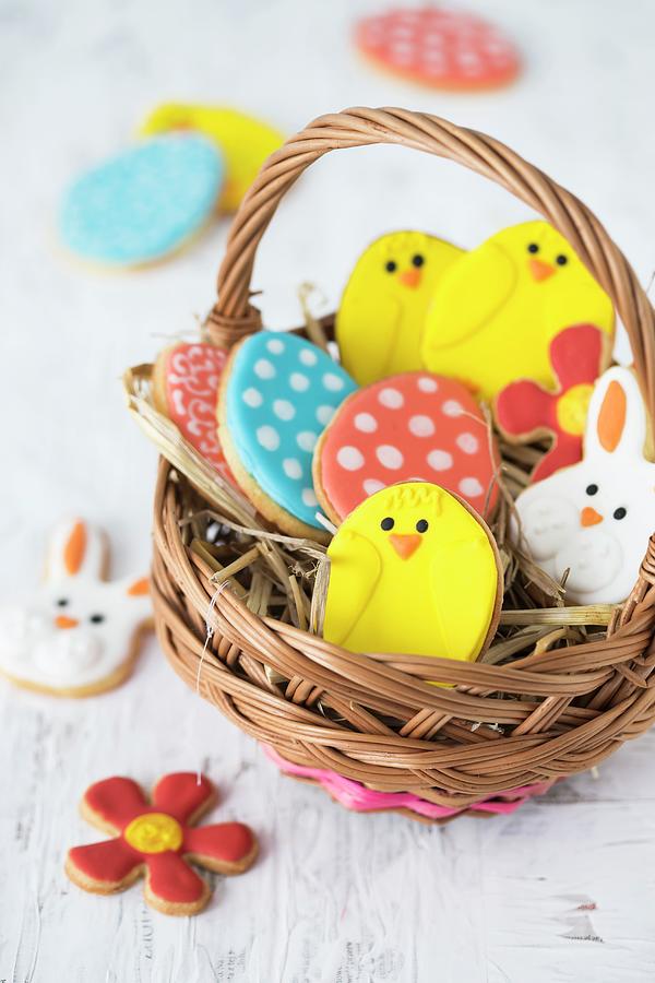Colourful Easter Biscuits In A Basket Photograph by Malgorzata Laniak