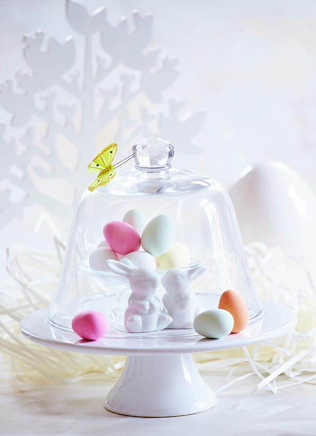 Colourful Easter Eggs And Easter Bunnies Under A Glass Cloche Photograph by Sven C. Raben