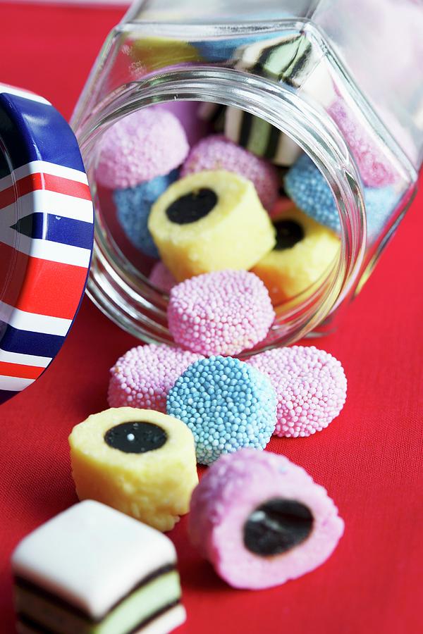 Colourful Liquorice From England In A Glass Jar Photograph by Angelica Linnhoff