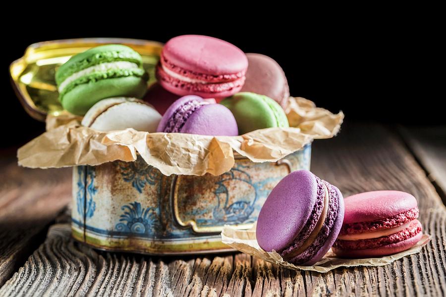 Colourful Macaroons In An Old Metal Tin Photograph by Shaiith